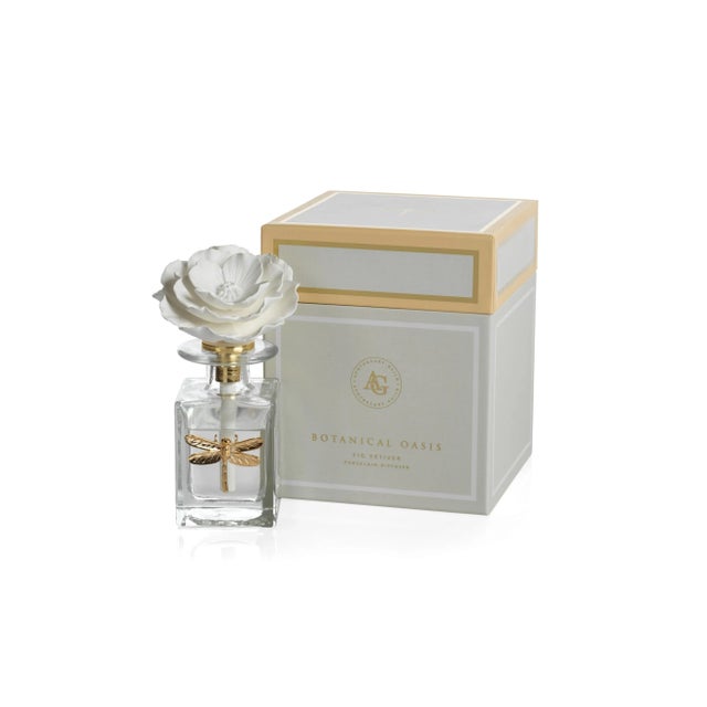 Enlightening. Elegant. Eye-catching. This lovely scent diffuser is a subtle way to softly fragrance a room all day. It...