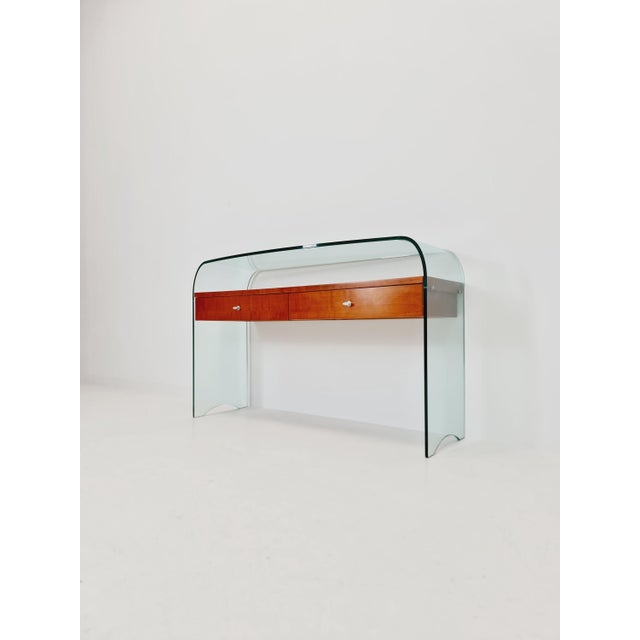 Fiam, Rialto chest of drawers, late 20th century, Italy. Curved tempered casing with a floating cherry wood inlay. Two...