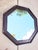 A massive faux leather octagonal wall mirror with antique stud design. The mirror is made of a real wood surround with a...