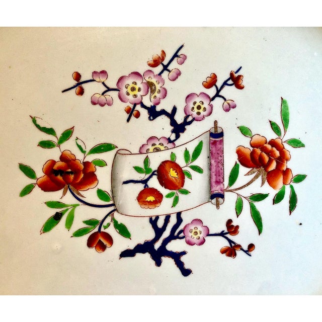 This is an antique early ironstone serving platter, manufactured in England during the early-to-mid 19th century, circa...