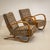 A pair of H-269 lounge chairs designed by Czech designer Jindřich Halabala in the 1930s. The distinctive, medium-brown...