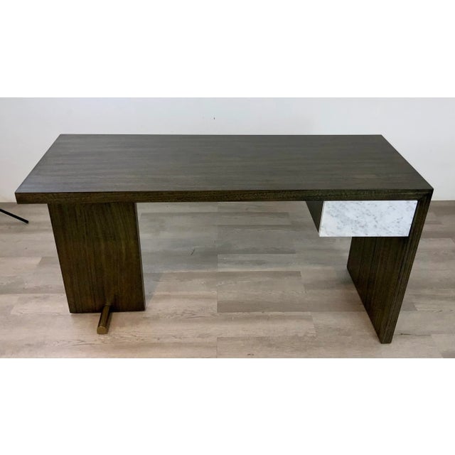 Stylish Caracole Organic Modern Edge Writing Desk, warm walnut finished wood, white marble drawer, satin brass finished...
