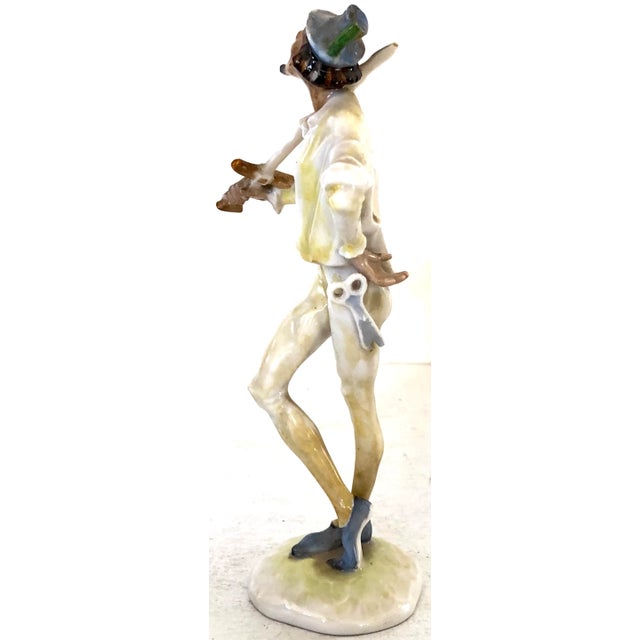 Charming Hutschenreuther porcelain figure of a man posed with his sword. Makers mark and label on the bottom is from the...