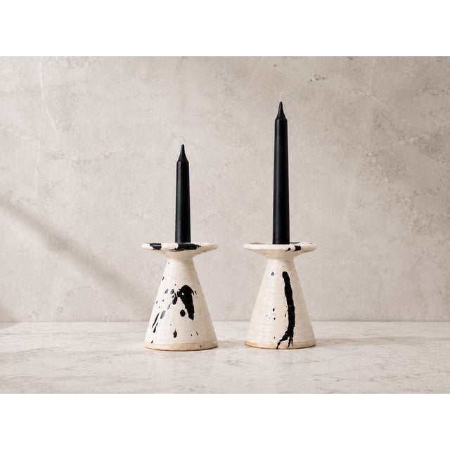 An extraordinary and highly collectible pair of vintage postmodern studio pottery candlestick holders created by the...