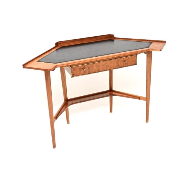 A stylish and very well made vintage leather top corner desk. This was made in England, it dates from the 1960’s. It is of...