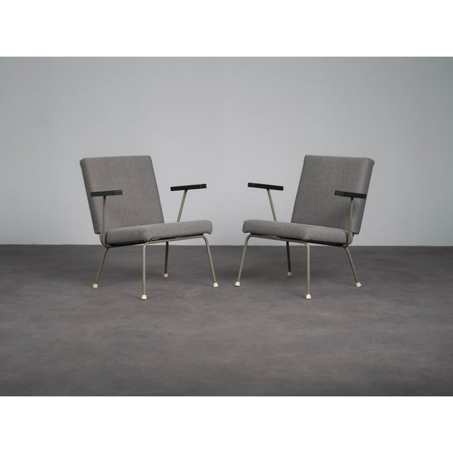 A striking pair of model 1401 armchairs designed by wim rietveld for gispen in 1954. Characteristic of rietveld’s...