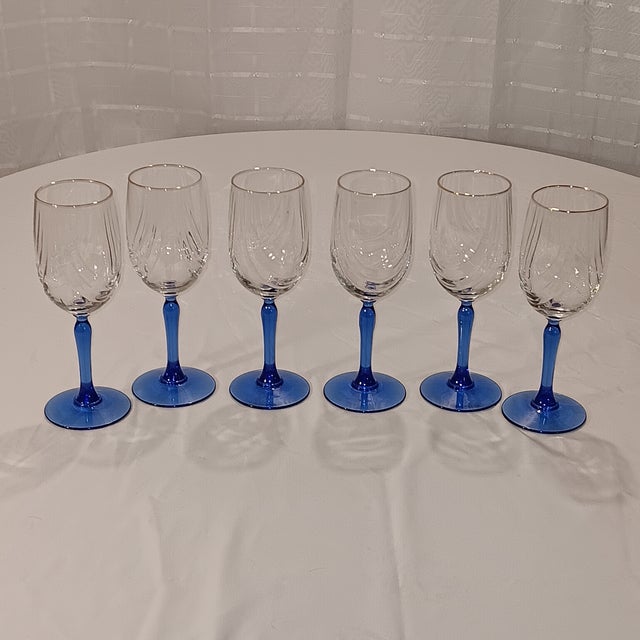 Vintage Lenox blue stem crystal wine glasses with dual swag draped and gold rim. Gold edging around rim do not show any...