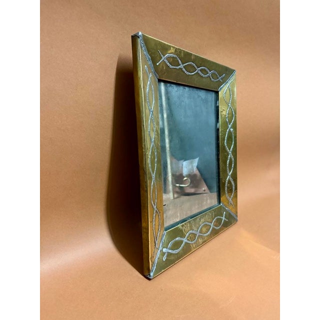 In speckled silver mirrored brass This piece is attributed to the mentioned designer/maker. It has no attribution mark and...