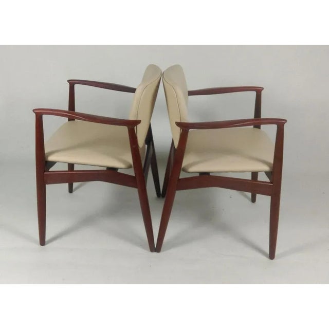 Fully restored 1960s Erik Buch model 67 "Captains Chair" in teak including custom reupholstery. The well designed organic...