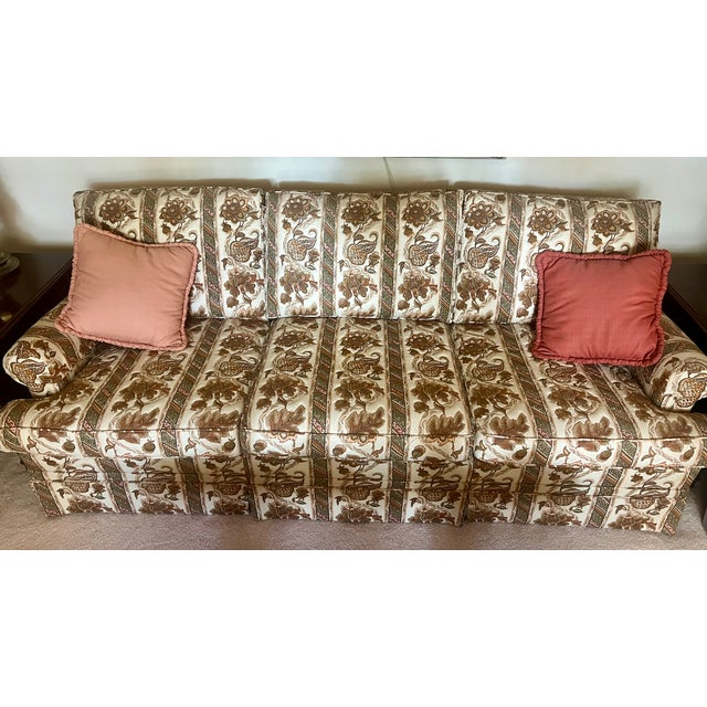 Beautiful Ethan Allen sofa featuring a classic traditional design with rolled arms and a high back. Upholstered in an...