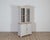 A charming Swedish bookcase from the late 19th century, newly repainted in a soft grey on the exterior with a bluish-grey...