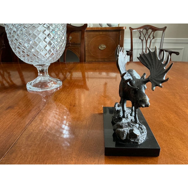 Incredibly detailed solid brass ( with bronze finish sculpture of a moose styled after Robert B Tate’s work. It sits on a...