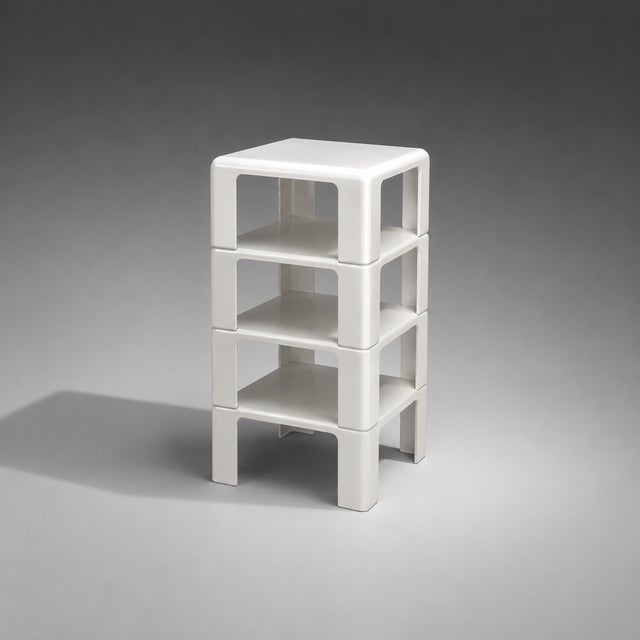 A unique take on the concept of nesting tables, instead of stacking underneath each other these Italian mid century tables...
