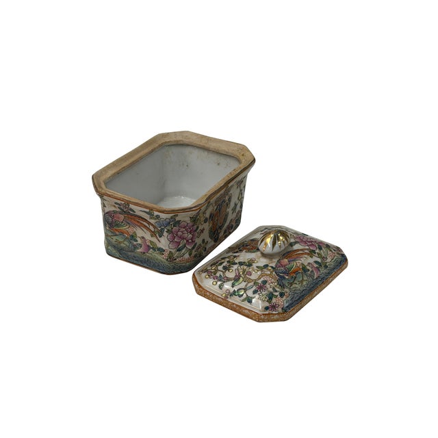 This export porcelain rectangular box and cover features a gently domed lid centered with a fluted, gilt-accented bud...