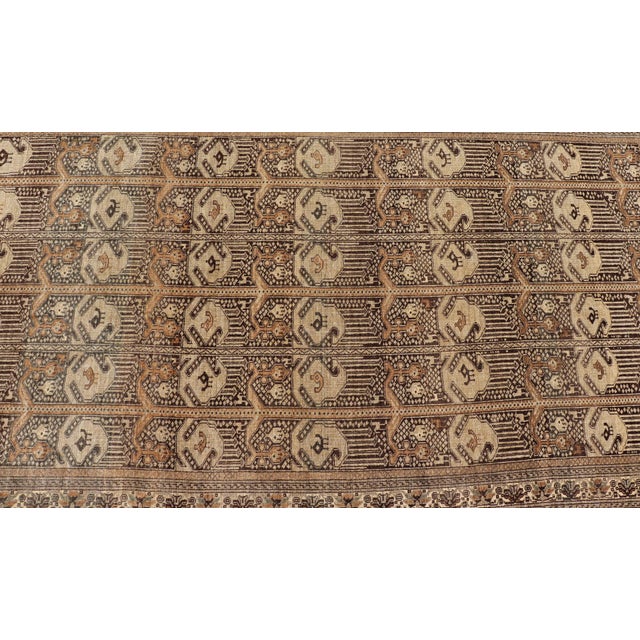 This Ersari rug has been hand-knotted in the finest wool. The rug features a repeating derivative of a tribal beluch...