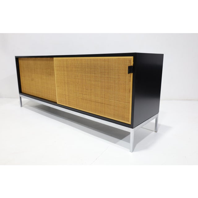 A beautiful sideboard/credenza by Florence Knoll for Knoll Associates. Dated 1965. The sideboard features a restored black...