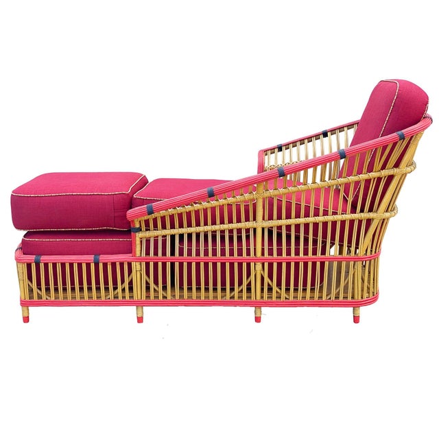 Relax in this restored 1930 "President" stick rattan chaise lounge chair. The lounge features a spindle design with a fan...