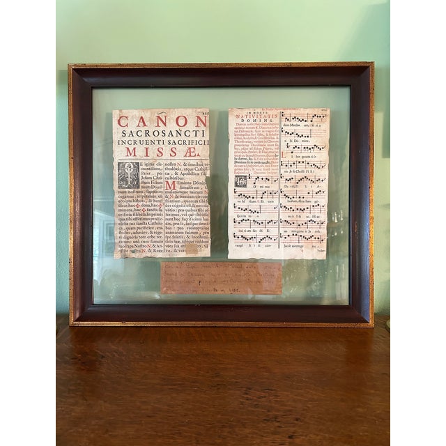This professionally framed pair of missal pages are from our private collection. The pages were found in a box in a...