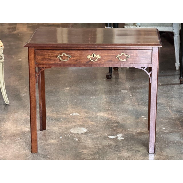 Late 18th century English George III mahogany side table with a molded top over a single long drawer fitted with brass...