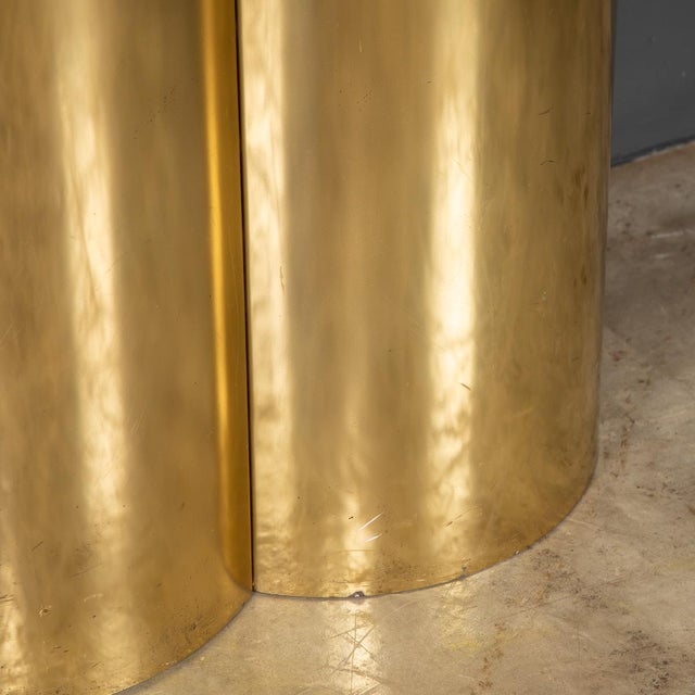 Curved brass covered base with toughened glass top can be used as side tables or console table. Width: 120cm Depth: 44cm...
