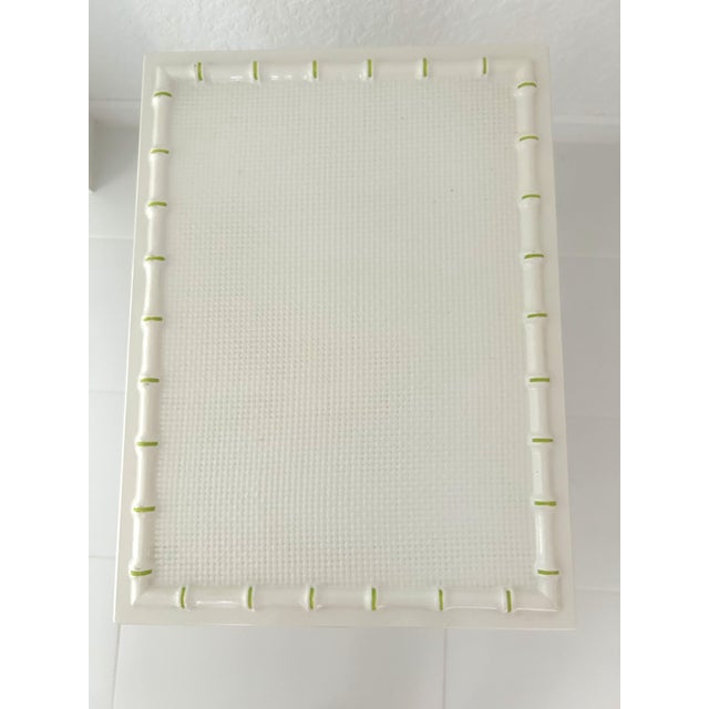 Stylish, mid-century, Hollywood Regency style faux bamboo design white solid wood side table featuring a basket weave...