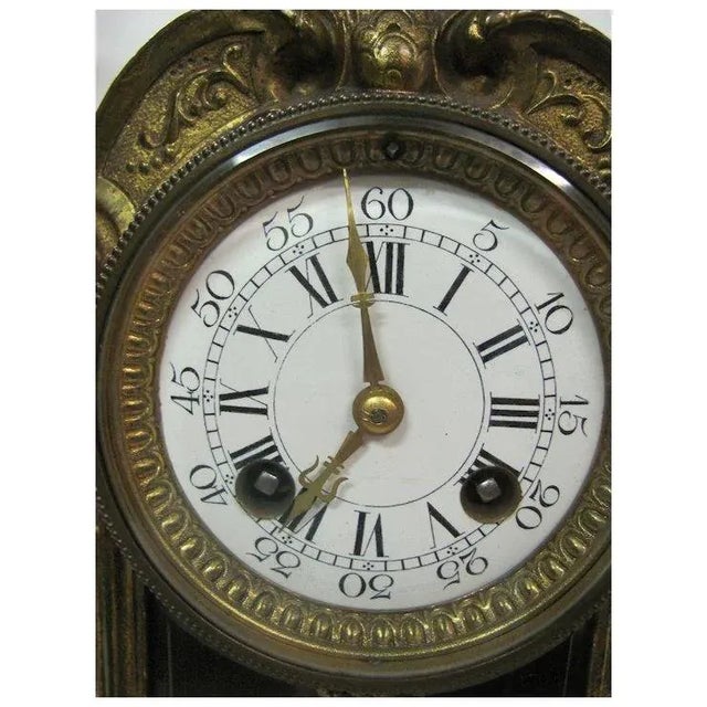 Beautiful 3 piece bronze clock set Clock: H: 17" x W: 8.75" x D: 5" Candle Sticks: H: 19" x Base: 4" x 4" Chairish sells...