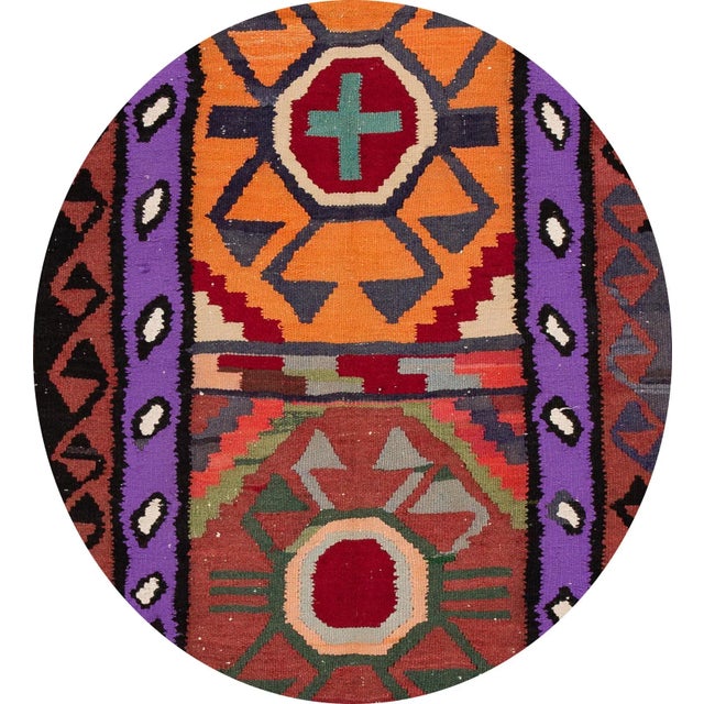 A beautiful hand-woven vintage Kilim runner with a multi-color field an all-over geometric design. This rug measures: 3'...