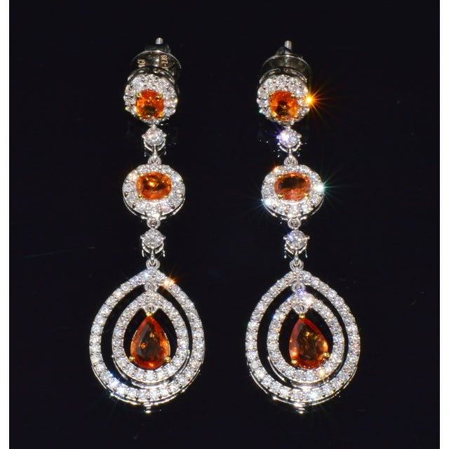 Gorgeous 4.95CTS diamond and natural orange sapphire chandelier earrings. These elegant chandelier earrings are set with...