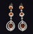 Gorgeous 4.95CTS diamond and natural orange sapphire chandelier earrings. These elegant chandelier earrings are set with...