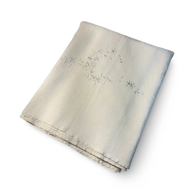"A dreamy antique French linen tea towel, extra-large and beautifully woven, with two hand-embroidered C monograms, one at...