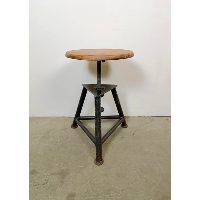 Industrial three-legged height adjustable workshop stool made in former Czechoslovakia during the 1960s. Measures: Min.-...