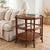 Vintage Palm Beach Regency 3-tier octagonal side table with a sculptural faux bamboo frame and rich organic textures. Its...