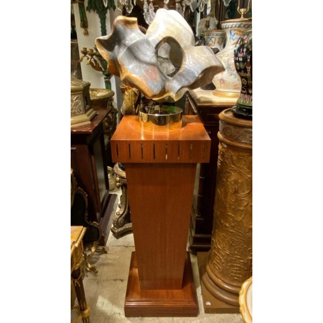 Abstract alabaster sculpture with pedestal by Karen Chera.
