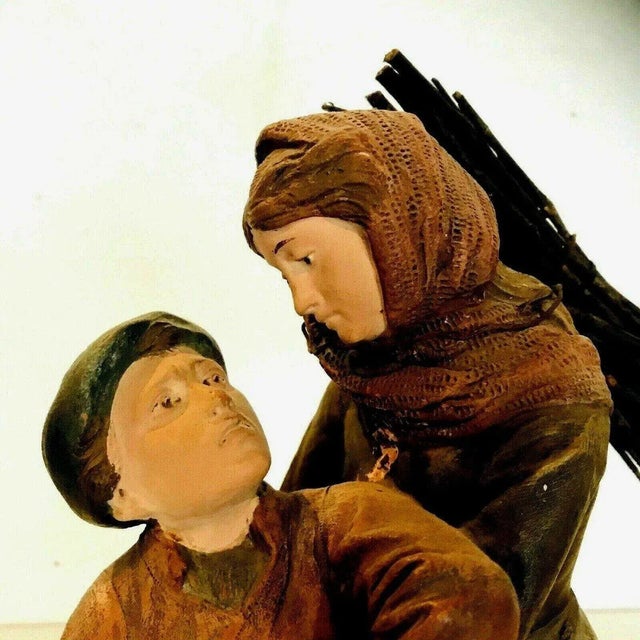 Patinated terracotta group Depicting two figures Bears the artist's signature and a numbered stamp (see photos) Good...