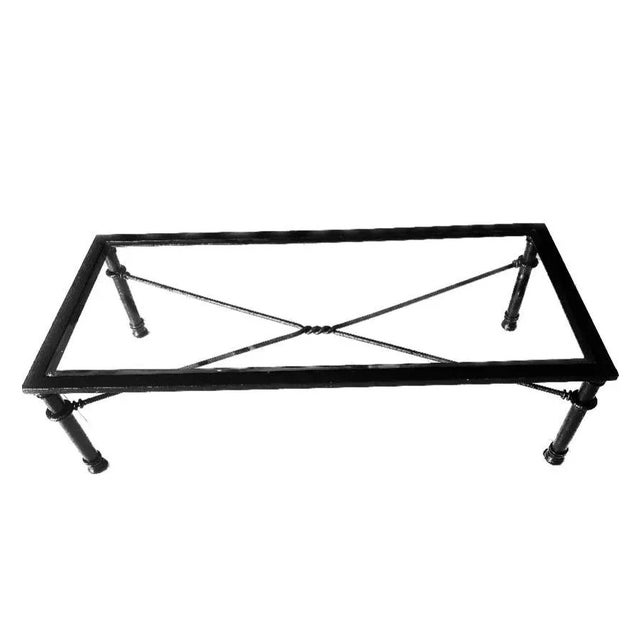 Brutalist glass top rectangular coffee table in a black finish combination of wrought iron and aluminum in the Giacometti...