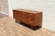 An exceptional Mid-Century Modern walnut dresser designed by the celebrated duo Kipp Stewart and Stewart MacDougall for...