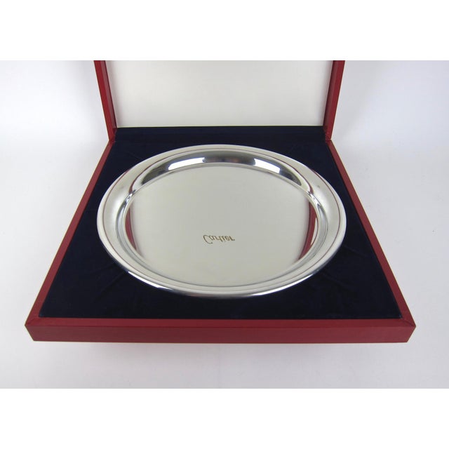 An elegant vintage Cartier silver serving tray in highly polished silvery pewter, made in France, circa 1977. The round...
