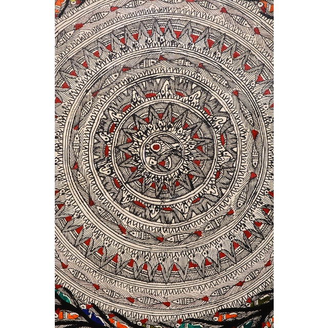 Celebrate the rich artistic heritage of India with this exquisite hand-painted Madhubani folk painting by Mamta Devi, a...