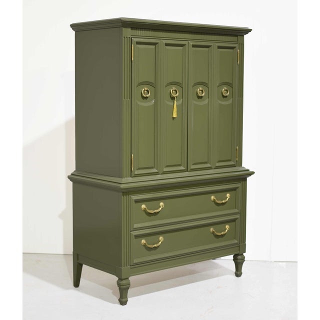 Fresh out of our paint studio, this Mid Century Transitional highboy dresser is newly painted in a rich, earthy olive...