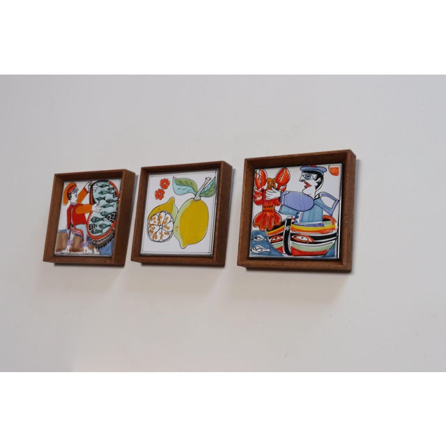 Set of three hand-painted ceramic tiles newly framed depicting scenes commonly associated with Sicilian/Italian coastal...