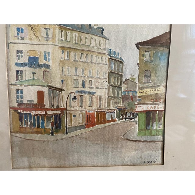 The watercolor of a paris street scene by a. Paly (1889-1979) is framed in a beautiful 19th century frame. The gouache...