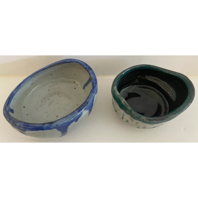 Set of 2 artistic potteries signed Cata on bottom. Beautiful colors and shapes. Dimension below are for the larger one....