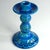 A large table vase made of ceramic decorated with sgraffito and glazed in colors known as Rimini Blue. The vase was...