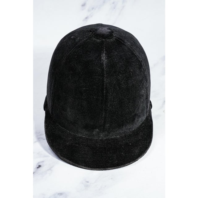 Capture the timeless elegance of classic equestrian style with this charming black velvet horse riding helmet, a wonderful...