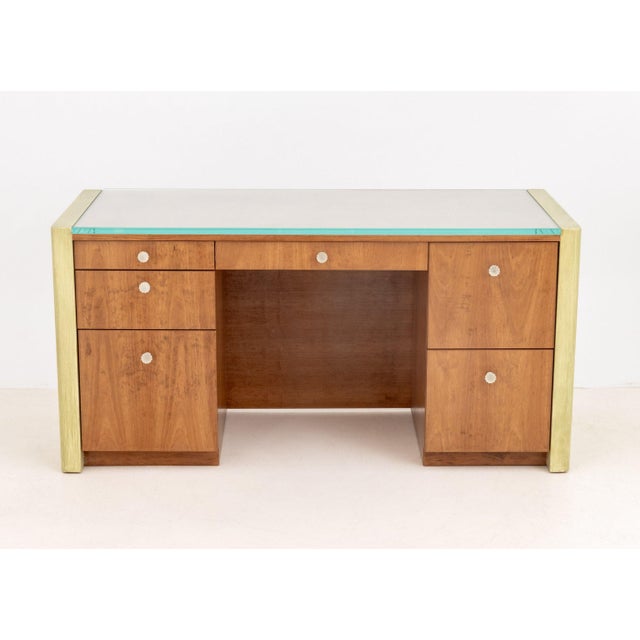 Art Deco Style Walnut Kneehole Desk, with green painted sides and rectangular glass top, the central drawer flanked by...