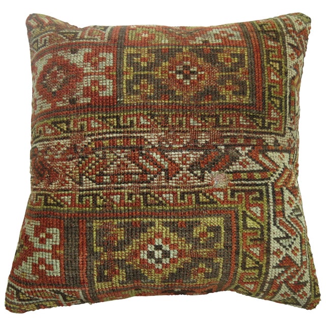 Pillow made from an antique Persian Kurd rug in rustic tones. Measures: 17" x 18".