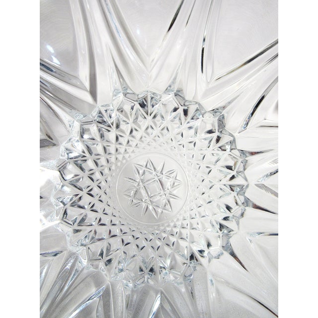 This is a charming old 10" cut glass bowl with a star burst pattern in the center. Gently footed as shown with beautiful...