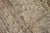A late 19th century worn antique room size Tabriz rug with a directional pattern in brown, rose, beige, and apricot tones....