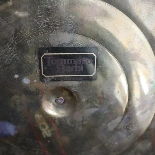 Light up your space with this vintage Murano lamp, a glass and brass work of art by Tommaso Barbi from the 1970s. Equipped...