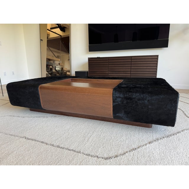 Custom-ordered Holly Hunt “Oasis” cocktail ottoman, purchased new in 2022. This striking piece blends the functionality of...